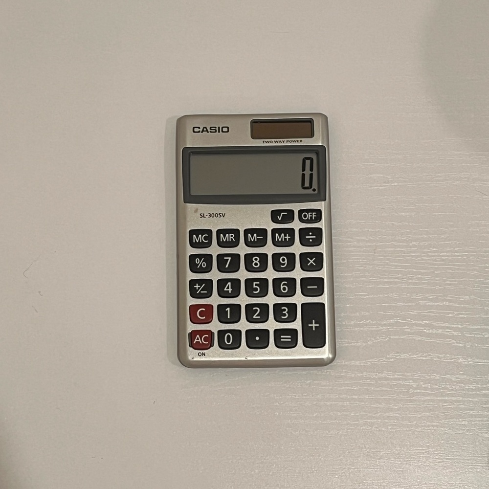 Casio Silver Calculator with Black and Red Buttons
